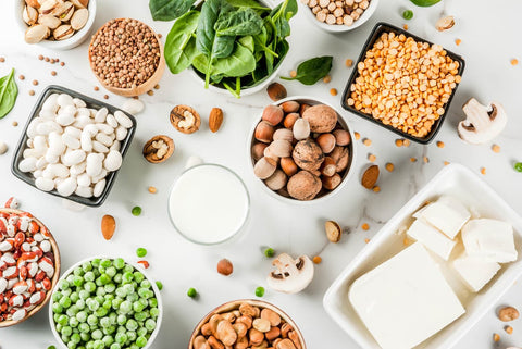 Bowls with nuts, cheeses, peas, beans and pistachios