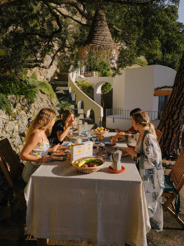 Person at table are smiling and happy