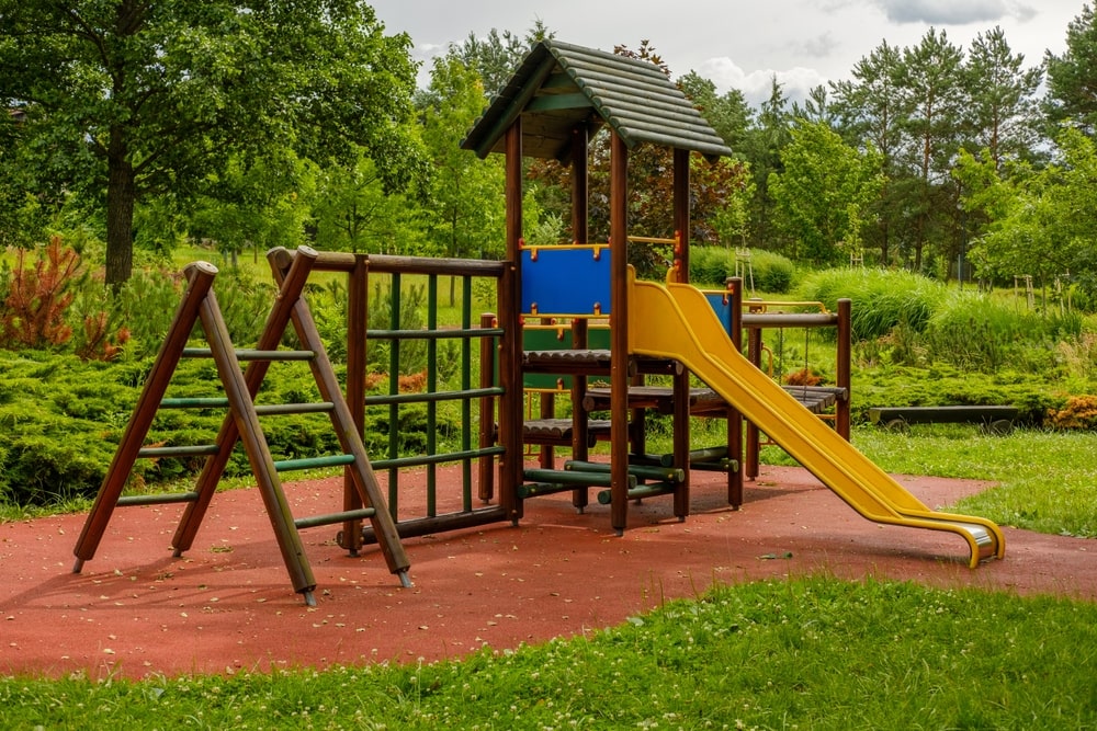 One of the best outdoor playsets for toddlers. A playset with an open slide, a sky loft, and a climbing ladder. 