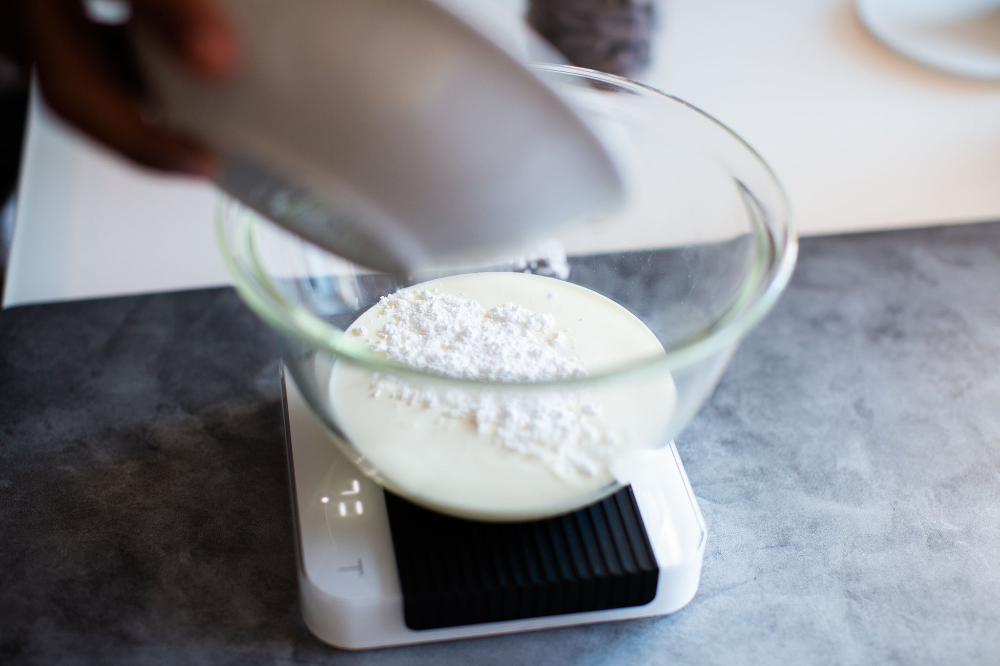 Weighing out whipping cream and icing sugar in a Hario Mixing Bowl using an Acaia Pearl Digital Scale