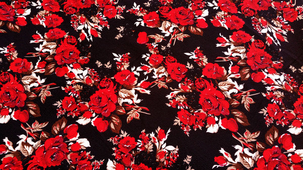Dark fabric with red roses on it