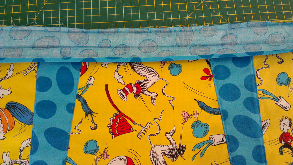 Attaching the waist tie to the rest of the pinny . . .