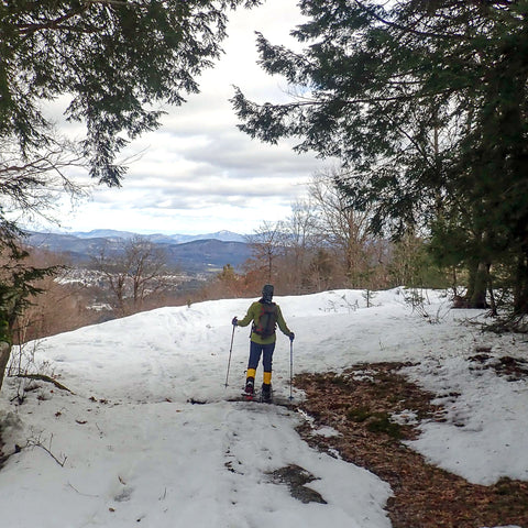 Snowshoer at the top of Hickory
