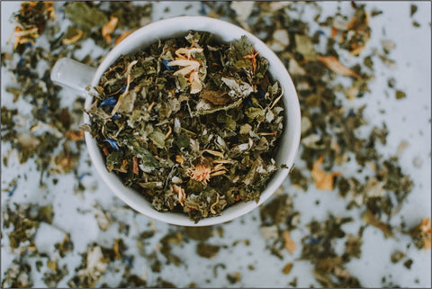 A Cup Filled with Loose Tea Leaves