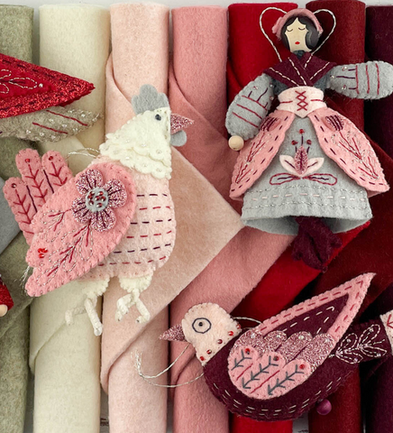 A few of the Twelve Days of Christmas ornaments done in the winter cardinals palette