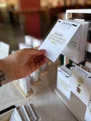 A customer taking a look at the stickers at a local event