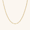 Mini Paperclip Necklace featuring multi-size gold links, displayed on a plain background, showcasing its bold yet casual design ideal for versatile wear.