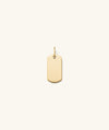 Flat Tag Charm: a gold dog tag featuring a logo, perfect for adding a classic touch to any jewelry stack.