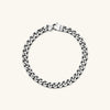 Silver 5mm Curb Chain Bracelet with a lock clasp, handcrafted in oxidized sterling silver for a stylish, lived-in look.