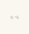 Pearl Oversized Studs: Close-up view of handcrafted 18k gold vermeil earrings featuring freshwater pearls.