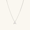 Silver Letter Necklace with initial pendant on a delicate chain, showcasing a sleek, modern design ideal for layering.