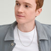 Man wearing a white shirt and gray jacket, showcasing the Round Box Chain Necklace, an everyday accessory that balances simplicity and style, complementing the Round Box Chain Bracelet.