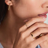 Close-up of a woman's hand wearing the Bold Stacker ring, showcasing its sleek design. The ring pairs well with other Stacker rings.