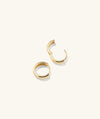 Bold Huggie Hoops, a pair of chunky gold hoop earrings, designed to elevate any outfit and boost your mood.