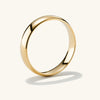 4mm Curve Band - A close-up of a sleek gold ring, ideal for marking a new chapter with its lightweight, durable design.