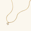 Round Topaz Necklace: A gold chain with a round cut topaz gemstone pendant, elegantly handcrafted in 18k gold vermeil.