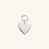 Silver heart-shaped keychain, engraved with pet details for a personalized touch. Durable and stylish accessory for pet lovers.