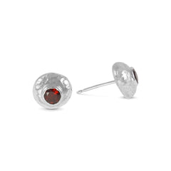 Handmade stud earring in silver set with garnet