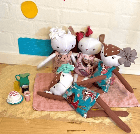 handmade dolls at the beach