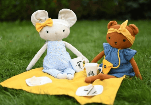 handmade dolls having a picnic made with studio seren doll sewing patterns