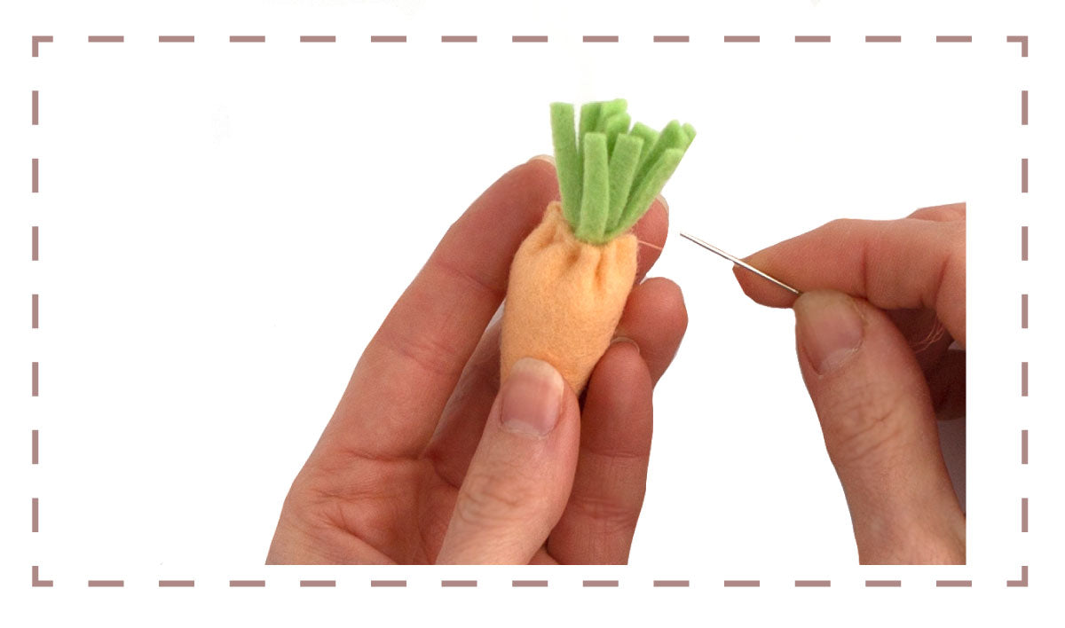 felt carrot sewing pattern - inserting the leaves