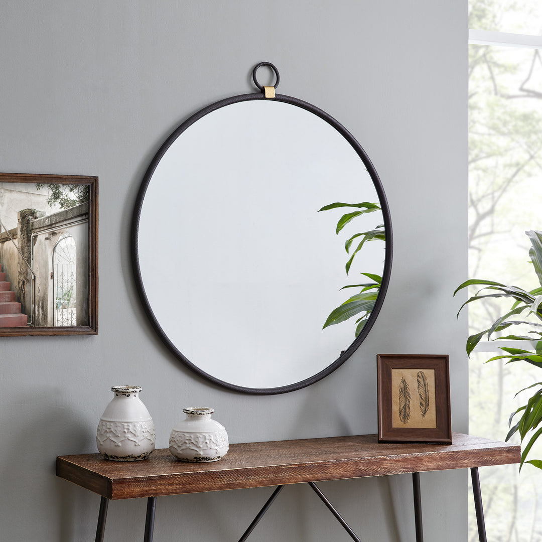 Black-and-white-entryway-with-large-round-custom-cut-mirror-design-375×500