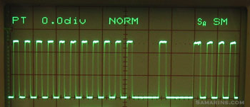 Crankshaft position sensor signal on the oscilloscope screen.