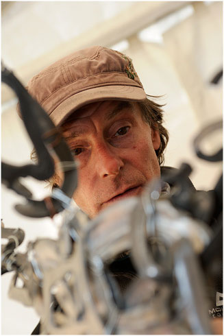 Andy Parkin lost in concentration piecing together his sculpture at LLAMFF 2011. © Ray Wood