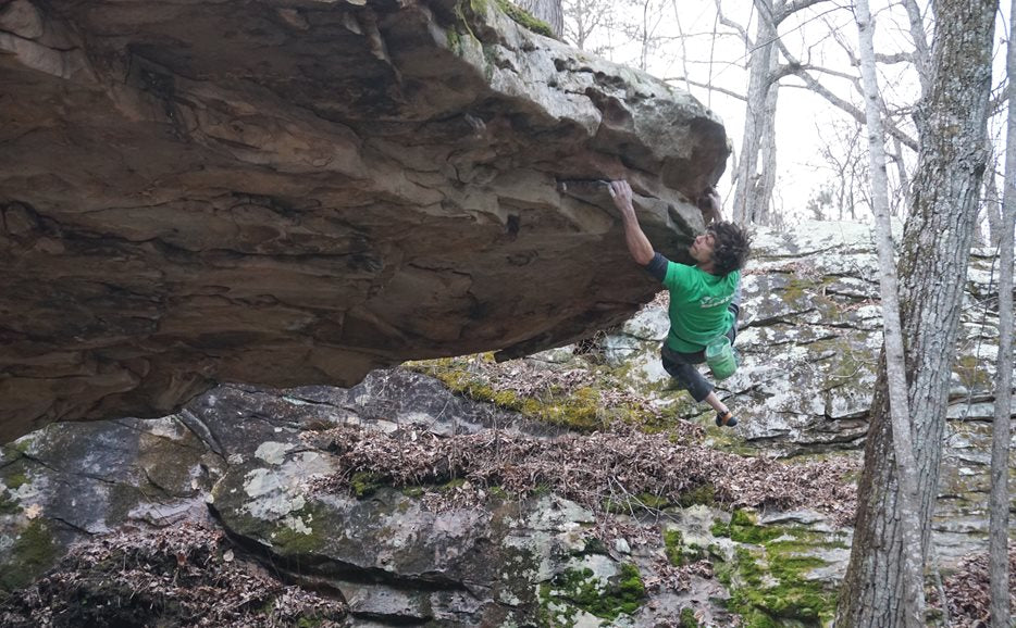Ricky on the First Ascent of Salo's Extension, V10, Chattanooga Tennesse. 