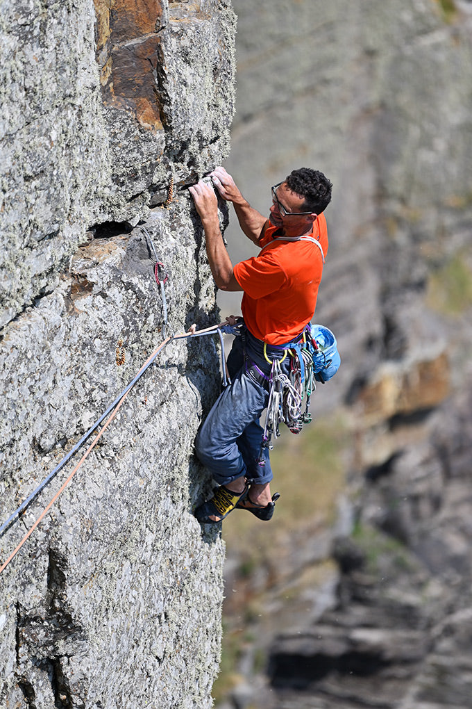 Nick Bullock traversing the Deadwood Wall on pitch 14.