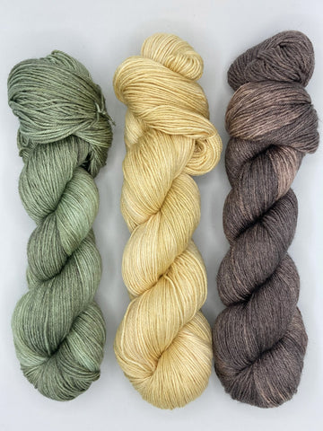 Avocado, Cornsilk, Kodiak yarn skein pairing suggestion by Red Door Fibers