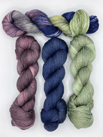 Mystic Queen, Plum Dandy, Navigation, Avocado yarn skein pairing suggestion by Red Door Fibers