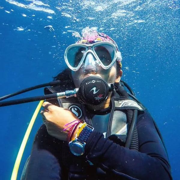 Diver in ocean wearing watch