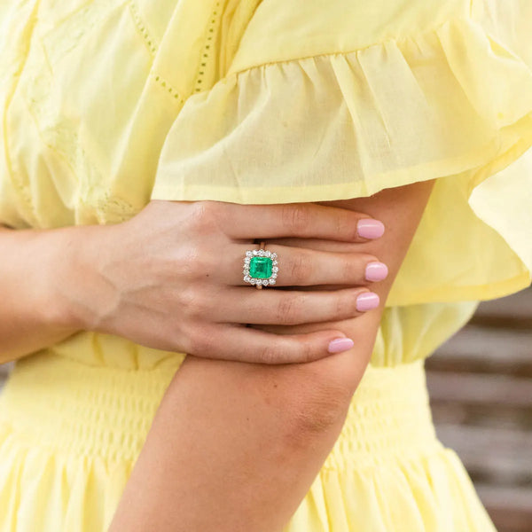 Green gemstone and diamond ring