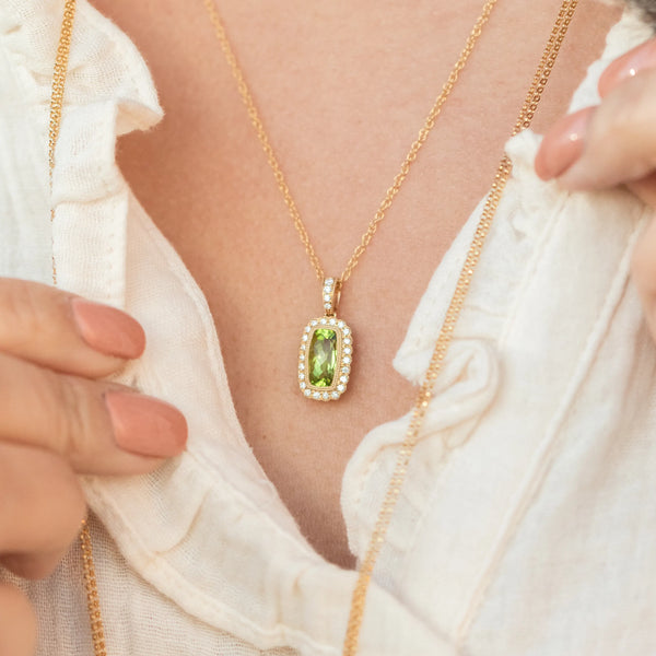 Green gemstone necklace with diamonds