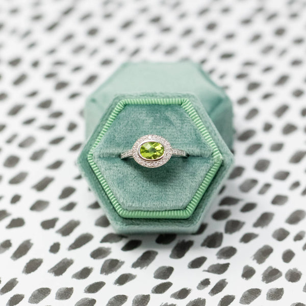 Green box with green gemstone ring