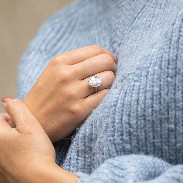 Diamond ring with blue sweater