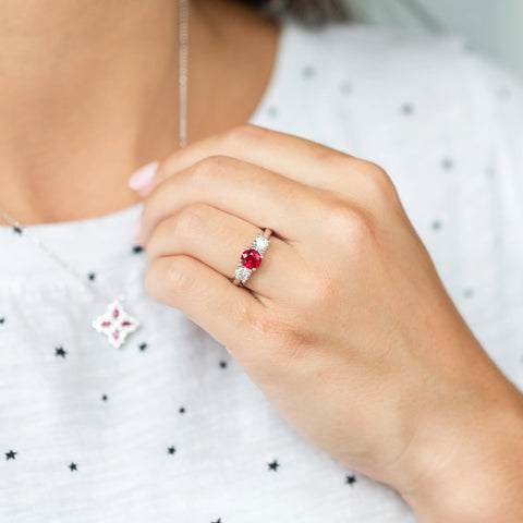 Red gemstone and diamond ring