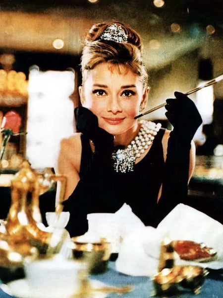 Audrey Hepbern wearing diamond and pearl necklace