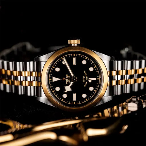 Mens Tudor black and gold watch