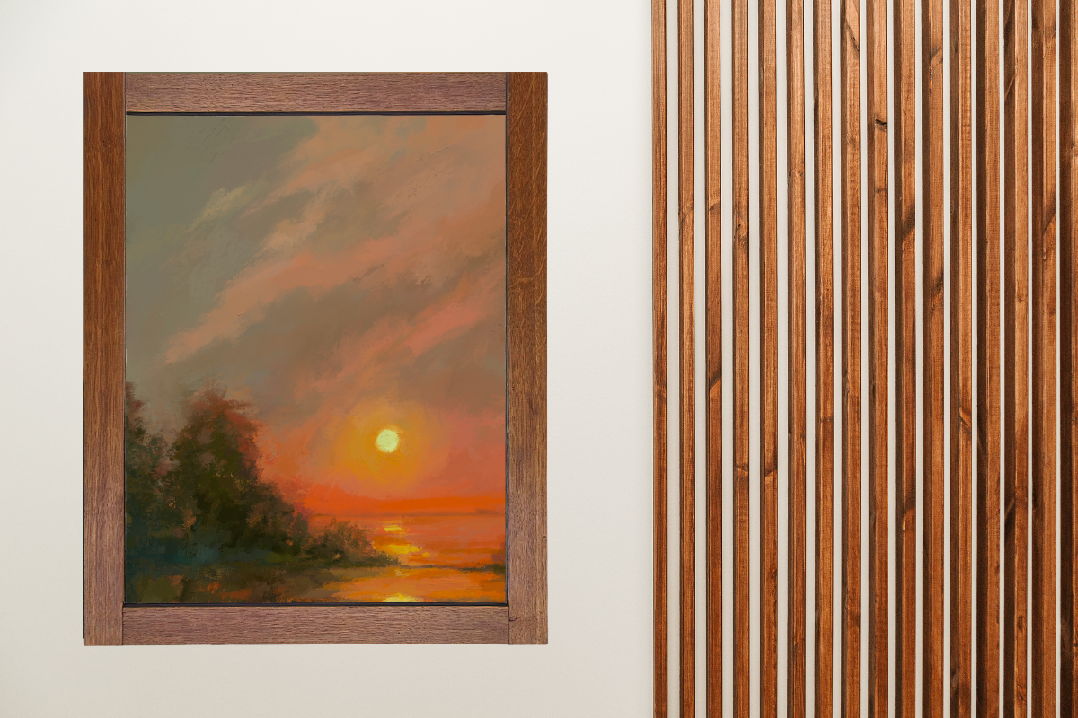 An oil painting artwork of a sunset hung on a wall