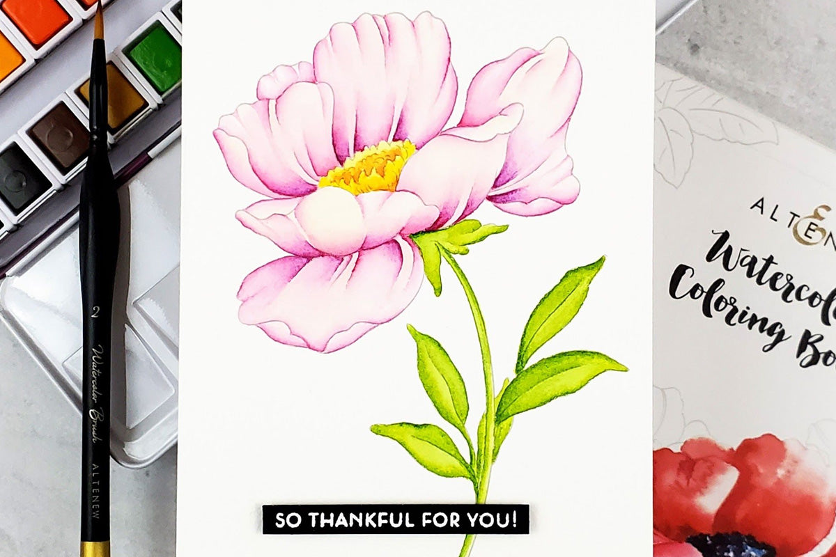 Watercolored flower painted with artist-grade watercolors, made using Artistry's Watercolor Coloring Book