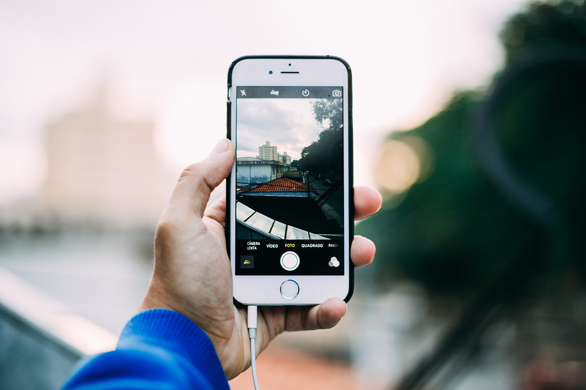 A man taking a photo using his mobile phone