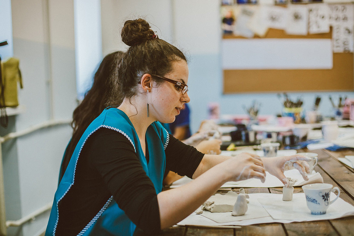 A woman in a pottery workshop