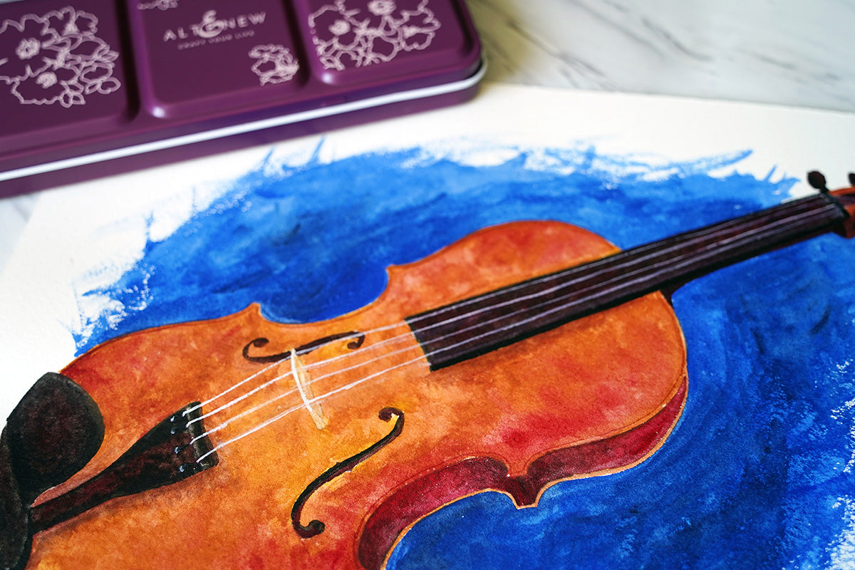 A watercolor painting of a cello painted with Artists' Watercolor 24 Pan Set