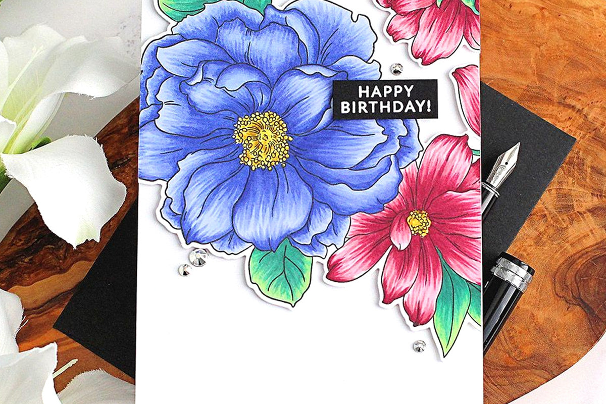 A birthday card with a gorgeous floral design, colored in with Altenew's Artists Markers
