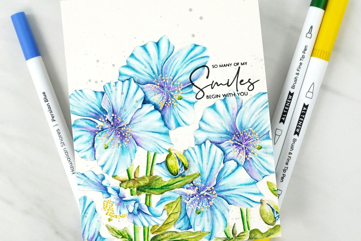 Blue flowers on a handmade card, colored using Artistry by Altenew's dual tipped water-based brush pens