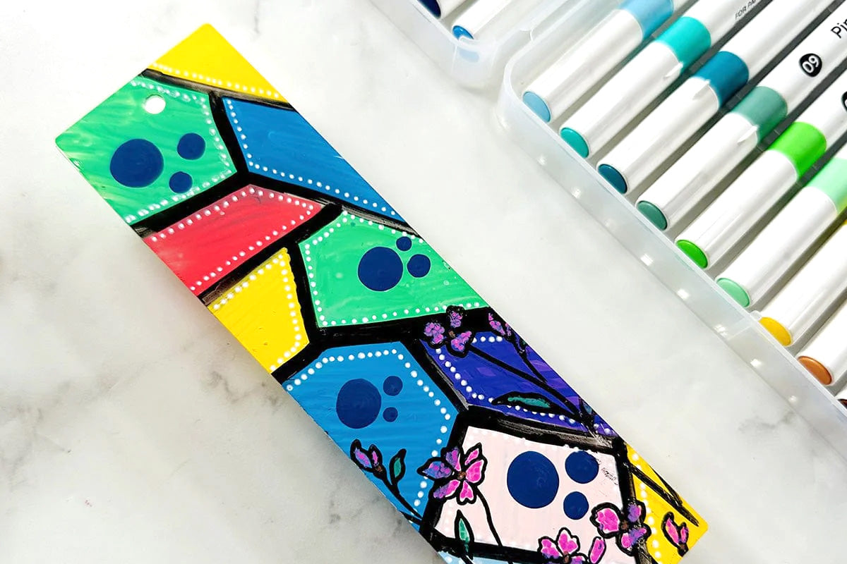 A stylish, colorful bookmark with geometric designs created with the Artistry by Altenew’s Acrylic Marker 24 Color Set