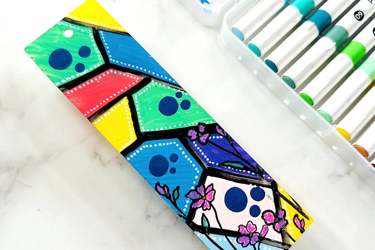 A fun, colorful, geometric bookmark with flower accents, created and colored in with the 24-Color Acrylic Marker Set
