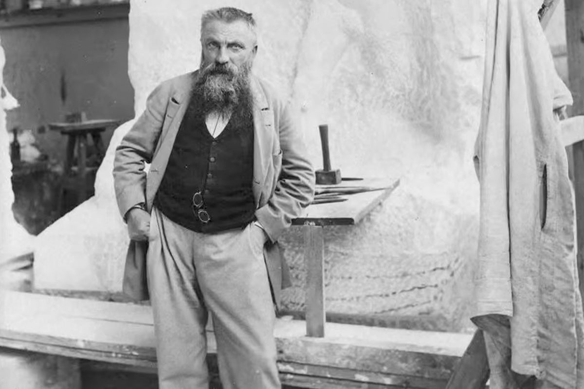 A black and white full photo of Auguste Rodin